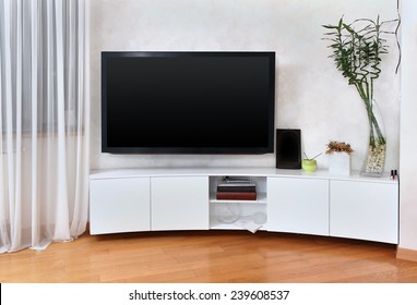 Large Flat Screen TV In Modern Interior Living Room