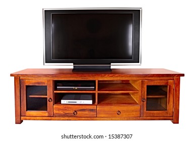Large flat wide-screen LCD television, on wooden cabinet.  Isolated on white.