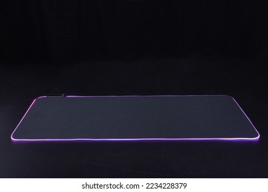 large flexible backlit mouse pad on a dark background 2022 - Shutterstock ID 2234228379