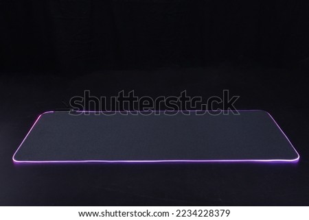 large flexible backlit mouse pad on a dark background 2022