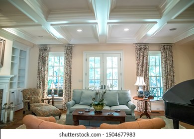 Large Formal Living Room In A Spacious Home. Arched Doorway Entrance And Comfortable Furniture With A Baby Grand Piano. Coffered Ceiling And A Lot Of Natural Light From The Large Windows.