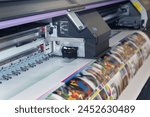 Large format printing machine in operation. Industry