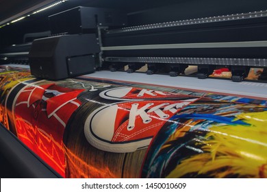 Large format printing machine in operation. Industry - Shutterstock ID 1450010609