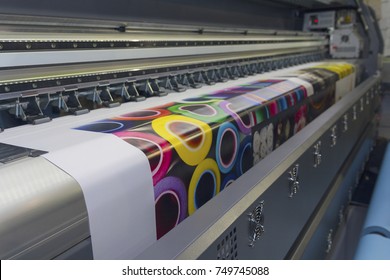 Large format printing machine in operation. Industry - Shutterstock ID 749745088