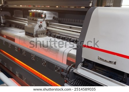 Large format printing machine in operation. Industry
