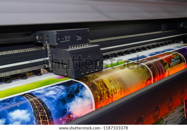 Large\
format printing machine in operation.\
Industry