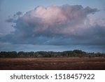 Large formidable cloud over the countryside at sunset. West Lothian, Scotland