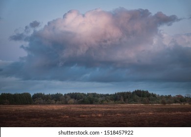 Large formidable cloud over the countryside at sunset. West Lothian, Scotland