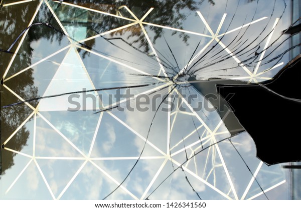 large fragment broken black mirror on white
bacground waporway glass with
cracks