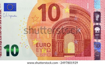 large fragment of the obverse of 10 ten Euro bill banknote, the currency of the European Union with Romanesque style Roman architecture on design, European euros money, inflation and money concept
