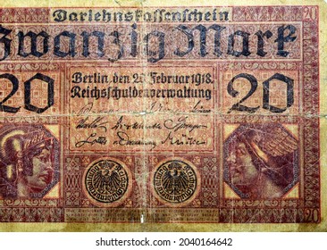 Large fragment of the obverse side of 20 twenty German marks banknote currency issued 1918 by Germany Reichsschuldenverwaltung in Berlin,   Note features Minerva and Mercury