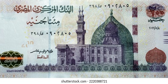 Large fragment of the obverse side of 200 LE EGP two hundred Egyptian pounds cash money banknote paper series 2022 features the mosque of Qani-Bay in Cairo, Egypt, selective focus of Egyptian money - Shutterstock ID 2220388721