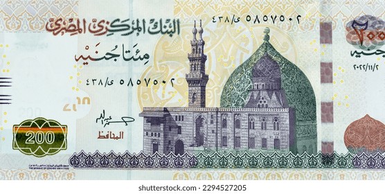 Large fragment of the obverse side of 200 LE two hundred Egyptian pounds banknote series 2022 features Qani-Bay mosque in Cairo Egypt, selective focus of Egypt cash money bill by central bank of Egypt - Shutterstock ID 2294527205