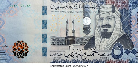 Large fragment of the obverse side of 500 five hundred Saudi riyals banknote features Kaaba in Mecca and portrait of king AbdelAziz Al Saud series 1438 AH, Selective focus of Saudi Arabia currency - Shutterstock ID 2090870197