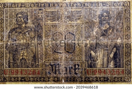 Large fragment of the reverse side of 20 twenty German marks banknote currency issued 1918 in Berlin Germany features a Knight and allegorical woman, vintage retro, old German money