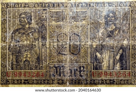 Large fragment of the reverse side of 20 twenty German marks banknote currency issued 1918 in Berlin Germany features a Knight and allegorical woman, vintage retro, old German money