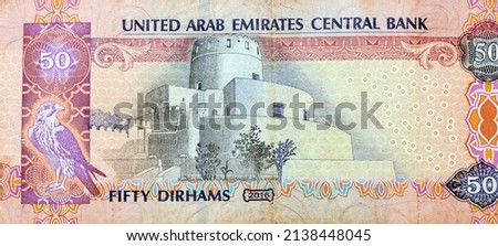 Large fragment of reverse side of 50 AED fifty Dirhams banknote of United Arab Emirates that features Al Jahili Fort which is one of the largest forts in the country, Emirates money banknote
