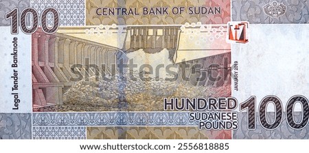 Large fragment of reverse side of one hundred Sudanese pounds issued by central bank of Sudan 2019, features Merowe hydroelectric dam river Nile that opened in 2009, Sudan money banknote