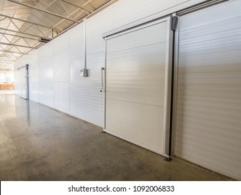 large freezer storage in the factory. closed door from warehouse