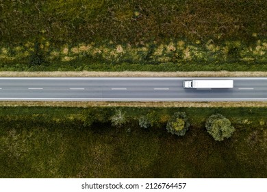 Large Freight Transporter Semi-truck On The Road, Aerial View Top Down From Drone Pov