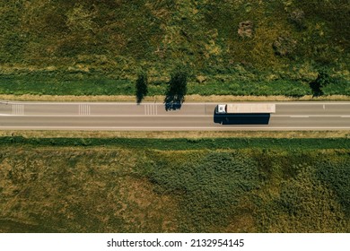 Large Freight Transporter Semi-truck On The Road, Aerial View Top Down From Drone Pov