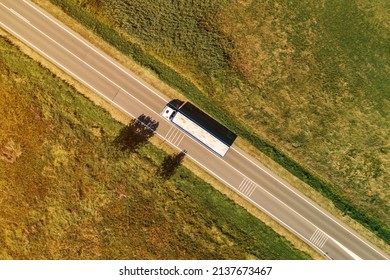 Large Freight Transporter Semi-truck On The Road, Aerial View Top Down From Drone Pov