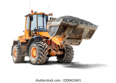 A large front loader transports crushed stone or gravel in a bucket at a construction site. Transportation of bulk materials. Isolated loader on a white background - Shutterstock ID 2200423691