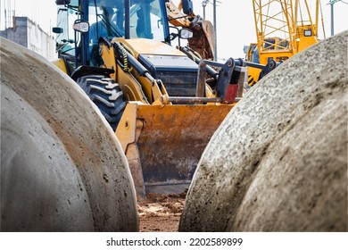 A Large Front Loader Transports Crushed Stone Or Gravel In A Bucket At A Construction Site Or Concrete Plant. Transportation Of Bulk Materials. Construction Equipment. Bulk Cargo Transportation