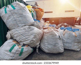 Large garbage bags that have been sorted and waiting to be transported to the waste disposal point. - Powered by Shutterstock