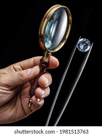 Large Gemstone And Loupe In Jeweler's Hands Close Up. Gem Identifying And Evaluating Process.