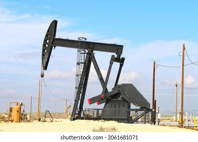 A Large Generic Black Oil Rig Derrick Pump Machine Refinery Desert Area Industrial Scene