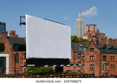 Large giant Billboard for Advertising without print neutral in Manhattan New York City. View from High Line Track with Empire State Building in the Background and old brick stone buildings.