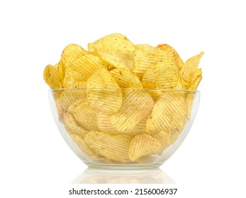 Large glass bowl with spiced potato chips. Isolated on white background.