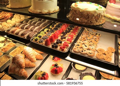 Large glass cases filled with variety of tempting, just baked pastries