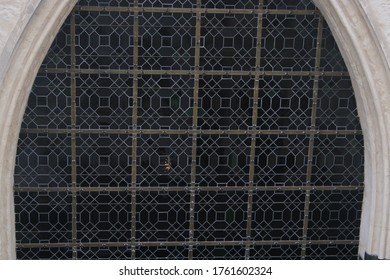 Large Glass In Lead Windown Of A Church Showing A Close Up Of The Squared Design Inside The Class
