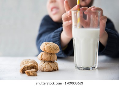 
A Large Glass Of Milk And Cookies On The Kitchen Table On The Background Of The Child. Baby Food And Kids Menu. Lactose And Gluten