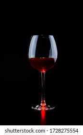 A Large Glass Of Red Wine On A Black Background