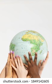 A Large Globe With All Continents Is Supported By Female Hands Of Various Races, Symbolizing Unity, Acceptance And Racial Tolerance.