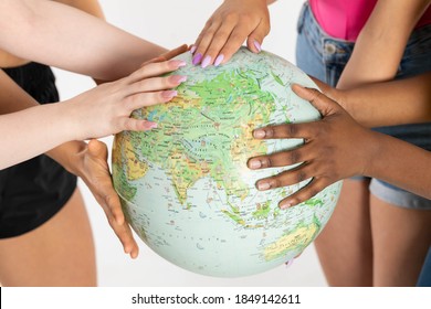 A Large Globe With All Continents Is Supported By Female Hands Of Various Races, Symbolizing Unity, Acceptance And Racial Tolerance.