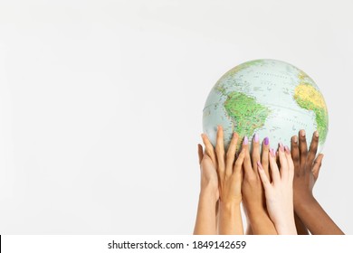 A Large Globe With All Continents Is Supported By Female Hands Of Various Races, Symbolizing Unity, Acceptance And Racial Tolerance.