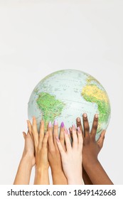 A Large Globe With All Continents Is Supported By Female Hands Of Various Races, Symbolizing Unity, Acceptance And Racial Tolerance.