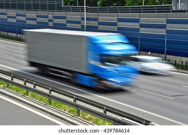 Large Goods Vehicle Moving At Full Speed On Six Lane Controlled-access Highway.
