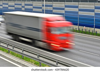 Large Goods Vehicle Moving At Full Speed On Six Lane Controlled-access Highway.
