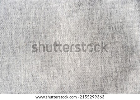 Large gray fabric texture or background, knitted cotton cloth, top view
