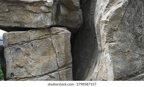 Large Gray Rock Surface With Deep Crevice and Rough Texture