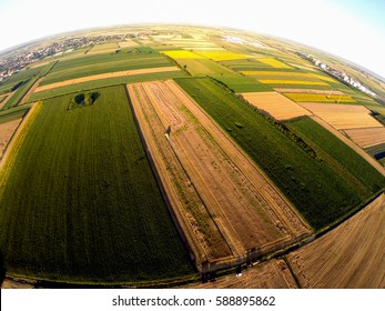 Large Green Agricultural Fields. Landscape Through Fish Eye Lens At Beautiful Sunrise In Countryside