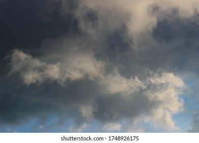 Large Grey Fluffy Clouds Close Up Of The Blue Sky