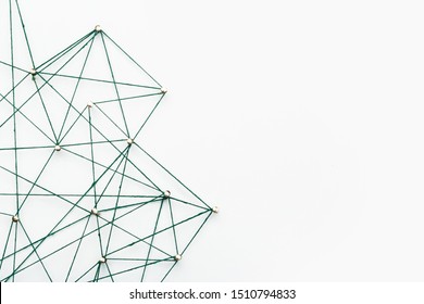 A large grid of pins connected with string. Communication, network concept