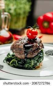 Large Grilled Filet Mignon Steak With Spinach. Grilled Meat Dish With Vegetables, Vertical Image. Top View. Place For Text,