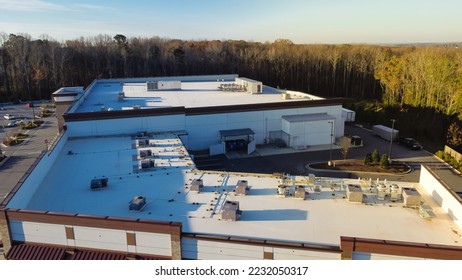 Large grocery store and strip mall with rooftop units for all in one HVAC solution in Flowery Branch, Georgia, USA.  Aerial view heating and air conditioning system in commercial building supermarkets - Shutterstock ID 2232050317
